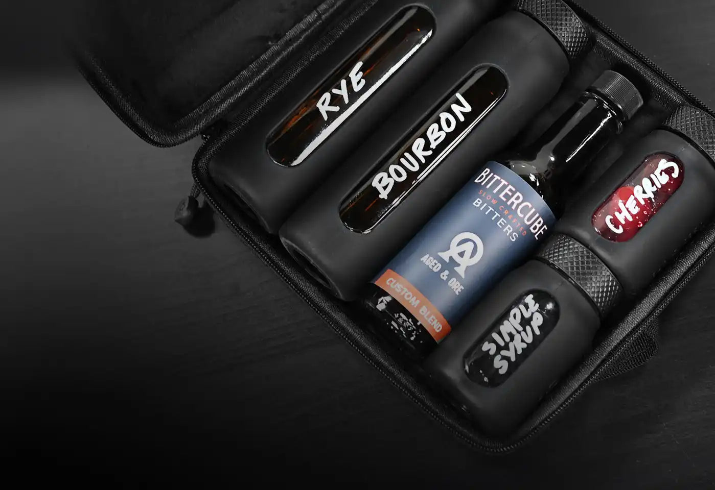 Black cocktail ingredient travel kit.