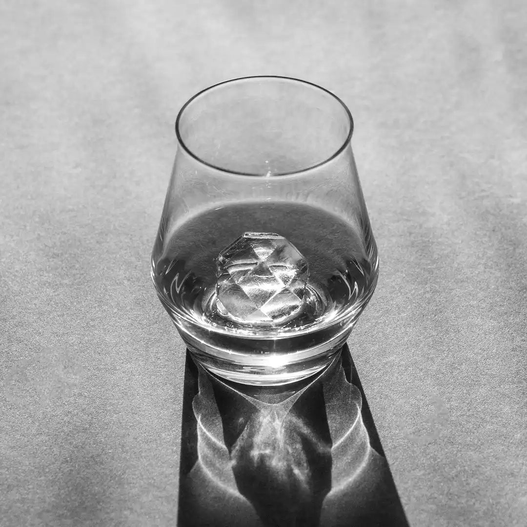Crystal-clear glass with faceted ice.